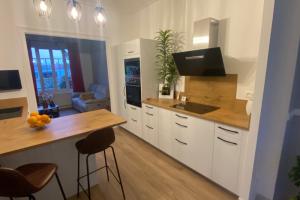 Rénovation et aménagement d’intérieur d’une maison sur Courseulles sur Mer avec la réalisation par Laro